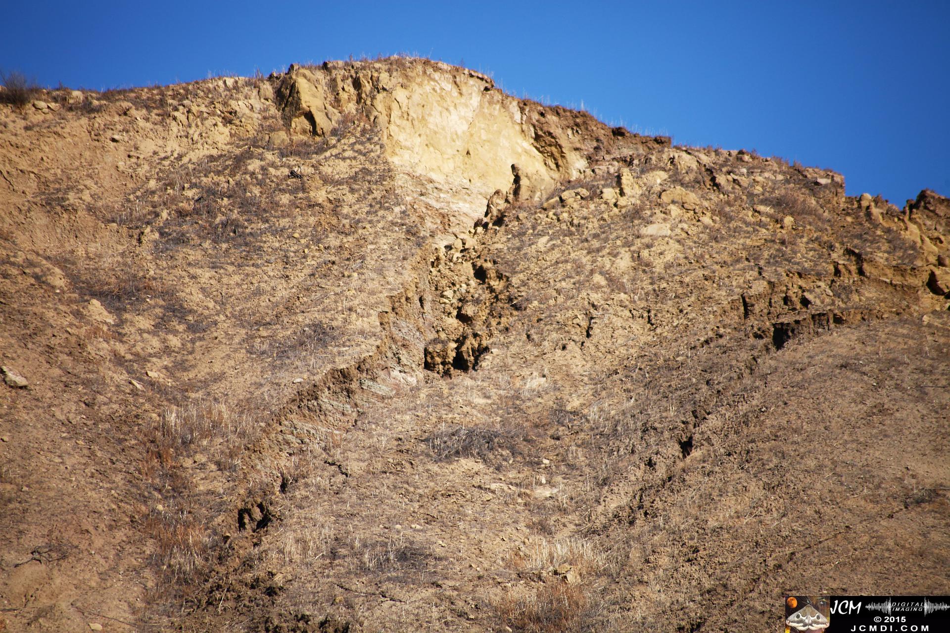 Landslide, buckled pavement, and terrain at Vasquez Canyon Road in Santa Clarita, CA filmed 11-25-2015